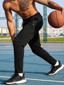 黑色宽松男士运动裤，轻盈透气面料，弹性腰带配抽绳，拉链口袋，适合夏季健身、跑步、篮球等运动。 - 黑色 - 查看 4