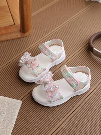 Wiosenne, nowe, jaskrawokolorowe sandały dziecięce z kokardką, modne sandały dziewczęce z lekką podeszwą EVA, płaskie, antypoślizgowe sandały dla dziewczynek w stylu księżniczki