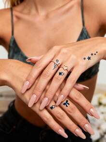 Herbal Juice Semi-Permanent Magic Finger Style Tattoo Sticker. Minimalist Tattoos. Romantic Texture Tulips, Double Hearts, Stars, Bowknot Patterns. Cute Small Fresh Pattern Tattoo Sticker. Daily Party Festival Gift. Shoulder, Neck, Arm, Finger, Earlobe, Back Of Leg, Collarbone, Body. Old School Tattoos. Semi-Permanent Tattoo. Waterproof. Long-Lasting Temporary Tattoo Sticker. Tattoo Sticker. Fake Tattoo. 1 Pack. - Blue - View 2