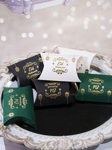 5个装开斋节枕形礼盒,金色灯笼/星星图案及“Eid Mubarak”(开斋节快乐)字样,绿色/黑色/白色礼盒,带装饰边框,非常适合开斋节/宰牲节庆祝活动、伊斯兰礼品及高档节日包装。 - 9.5x6.5x2.5cm - 查看 2