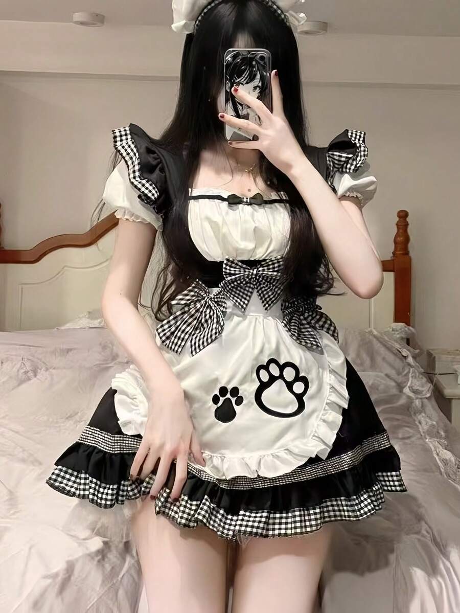1 chiếc đầm hầu gái Lolita cho bé gái dễ thương, với nơ nhỏ xinh và họa tiết dấu chân đáng yêu, kiểu dáng rộng rãi tôn dáng, phù hợp cho các lễ hội, chụp ảnh, tiệc tùng, cosplay và nhiều hoạt động mùa xuân khác. - Nhiều màu - Xem 1