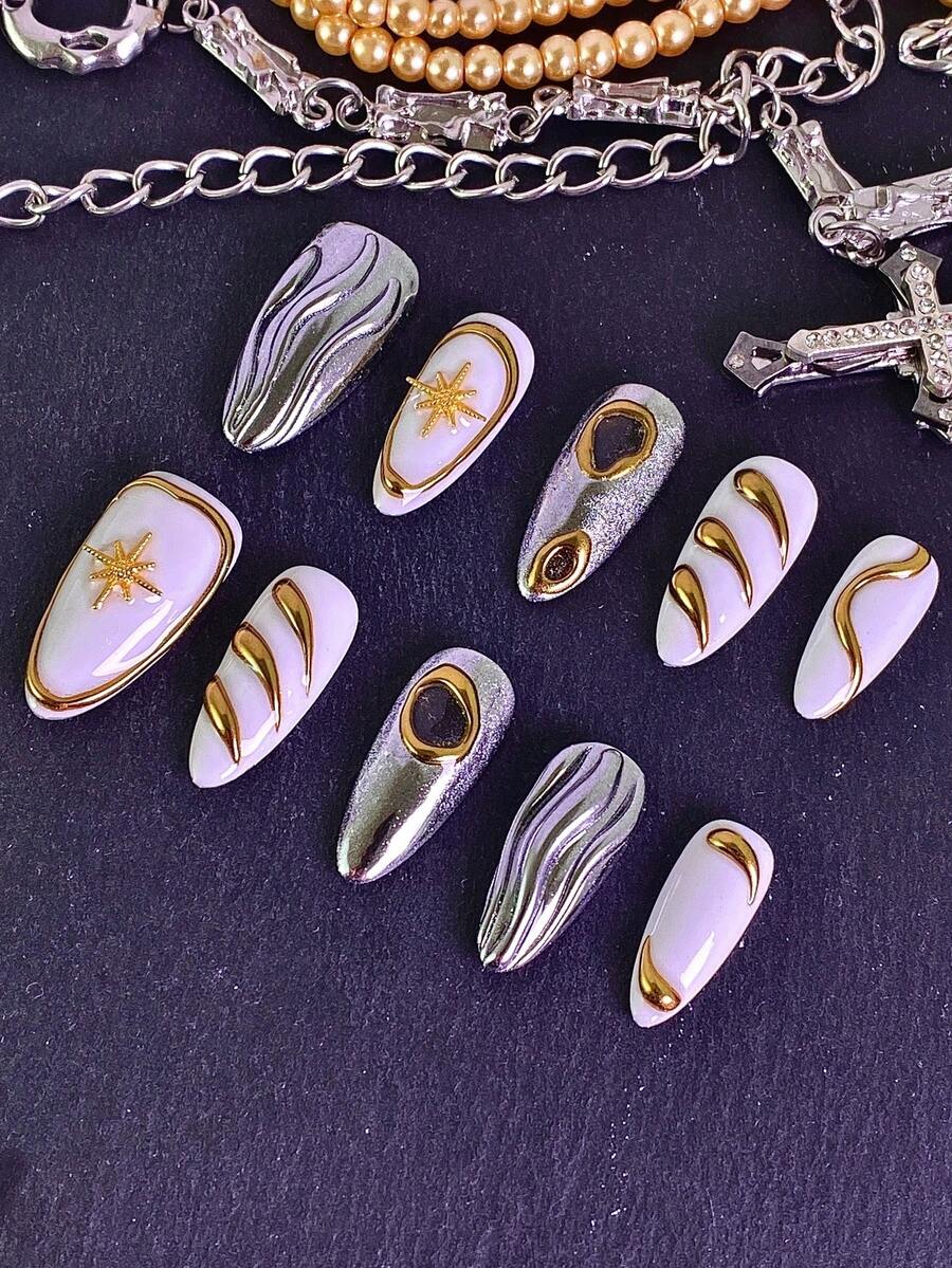 10片/套女士按压式美甲贴片，杏仁形甲片，饰以手工镶嵌的美甲宝石。白色底色，金色箔片纹理，点缀星星和水钻，尽显奢华质感。每片甲片都拥有独特的设计，闪耀夺目。这款全覆盖亮泽亚克力可重复使用假指甲套装包含指甲胶水和指甲锉，是新年派对、情人节、日常佩戴或馈赠亲友的理想之选。