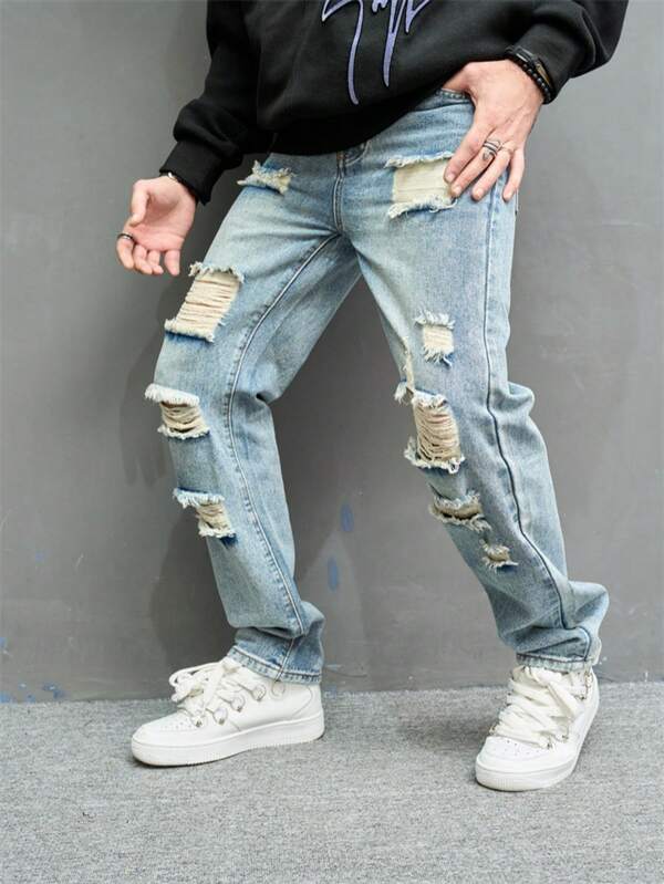 ‌Jeans azules de hombre con rotos y parches, estilo callejero americano
