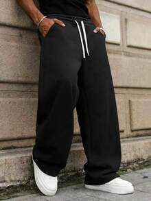 This Men's Casual Sweatpants Feature A Loose, Straight-Leg Silhouette With A Thermal Lined For Comfort And Drape. Suitable For Both Indoor And Outdoor Wear, It Also Makes A Great Gift For Couples. The Pants Are Made Of 100% Polyester Fabric And Have A Drawstring Waistband For Adjustable Fit, Available In Multiple Colors. - Black - View 7