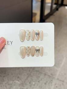 10片手工制作不对称3D线条波点蝴蝶结造型人造指甲，精致简约风格，适合情人节、派对等场合，包含指甲胶水和指甲锉。 - 彩色 - 查看 9