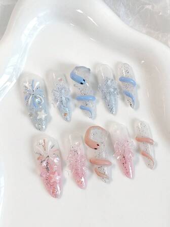 Valentine's Day. A Set Of 10 Long Almond-Shaped Handcrafted Exquisite Wearable Nails Featuring Y2K-Style Hand-Painted Blue And Pink Gradient Ombre With Sparkling Fine Glitter, Fireworks, Stars, And Three-Dimensional Resin Flowers.