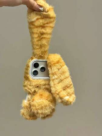 ふわふわのブラウンとイエローのストライプ柄、長い耳と短い尻尾のウサギのデザインのスマホケース、かわいい漫画スタイル、クリエイティブな新モデル、耐衝撃、iPhone 17 Pro Max、16、15に最適