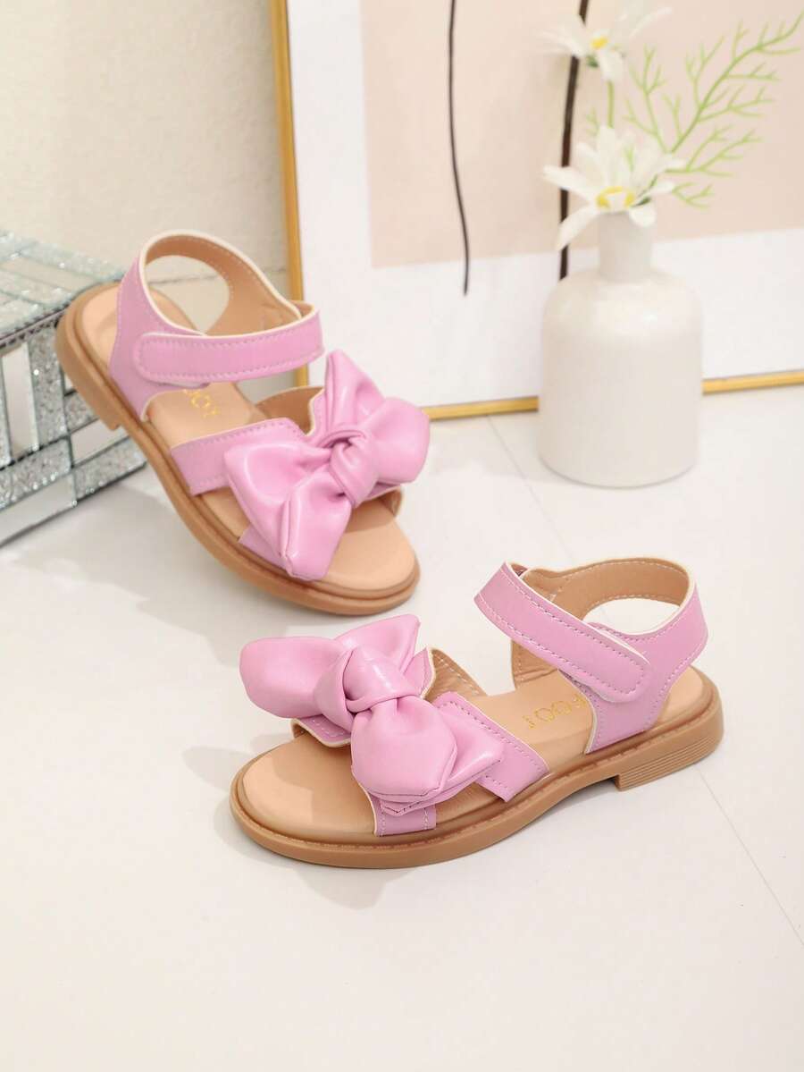 这款粉色蝴蝶结凉鞋充满甜美童趣，适合夏季生活、休闲场合、轻度正式场合、与小伙伴约会、日常外出和户外聚会。女童凉鞋、女童鞋、儿童凉鞋、凉鞋、沙滩鞋、童鞋 - 粉色 - 查看 1