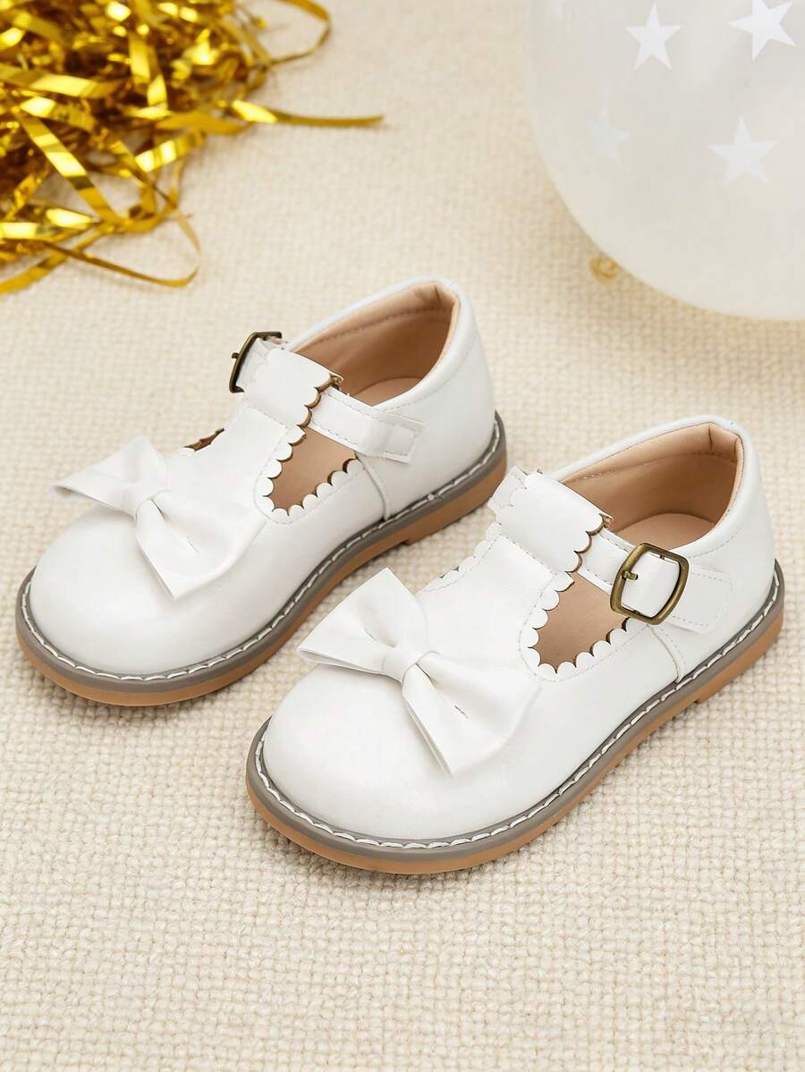 A Pair Of White Shoes With T-Strap,Metal Buckle,Bow - Leather Shoes,Oxford Shoes,Loafer Shoes,Flat Shoes Kids Shoes,Shoes,Girls Shoes,Girl Shoes,Zapatos De Niña,Toddler Girl Shoes,Kid Shoes,Zapatos Para Niñas,Shoes For Girls,Zapatos De Niño,Zapatos,Zapatos Para Niña,Kids,Shoes Kids,Zapatos De Niñas,Zapatos Para Niños,Little Girl Shoes,Zapatos Niña,Zapatos De Niños,Girls Dress Shoes,Girls,Flats,Zapatos Niñas,Toddler Girl,Shoes Girls,Loafers For Toddler & Little Girls & Little Boys | Ideal For School Day,Field Trip,After-School Playdate,Birthday Party,Family Brunch,Picnic,Church Service,Holiday Gathering,Art Class,Library Visit,Park Stroll,Weddings,Outings,Special Occasions,Christmas,New Year Celebrations - 5305 Trắng - Xem 1