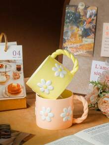 1pc 3D Embossed Ceramic Mug, French Countryside Style, Soft Pink/Yellow Body With White Daisy Pattern, Braided Handle, Rounded Rim, Suitable For Hot Beverages, Breakfast Milk Cup, Coffee Cup, Mother's Day Gift/Afternoon Tea With Friends, All Seasons