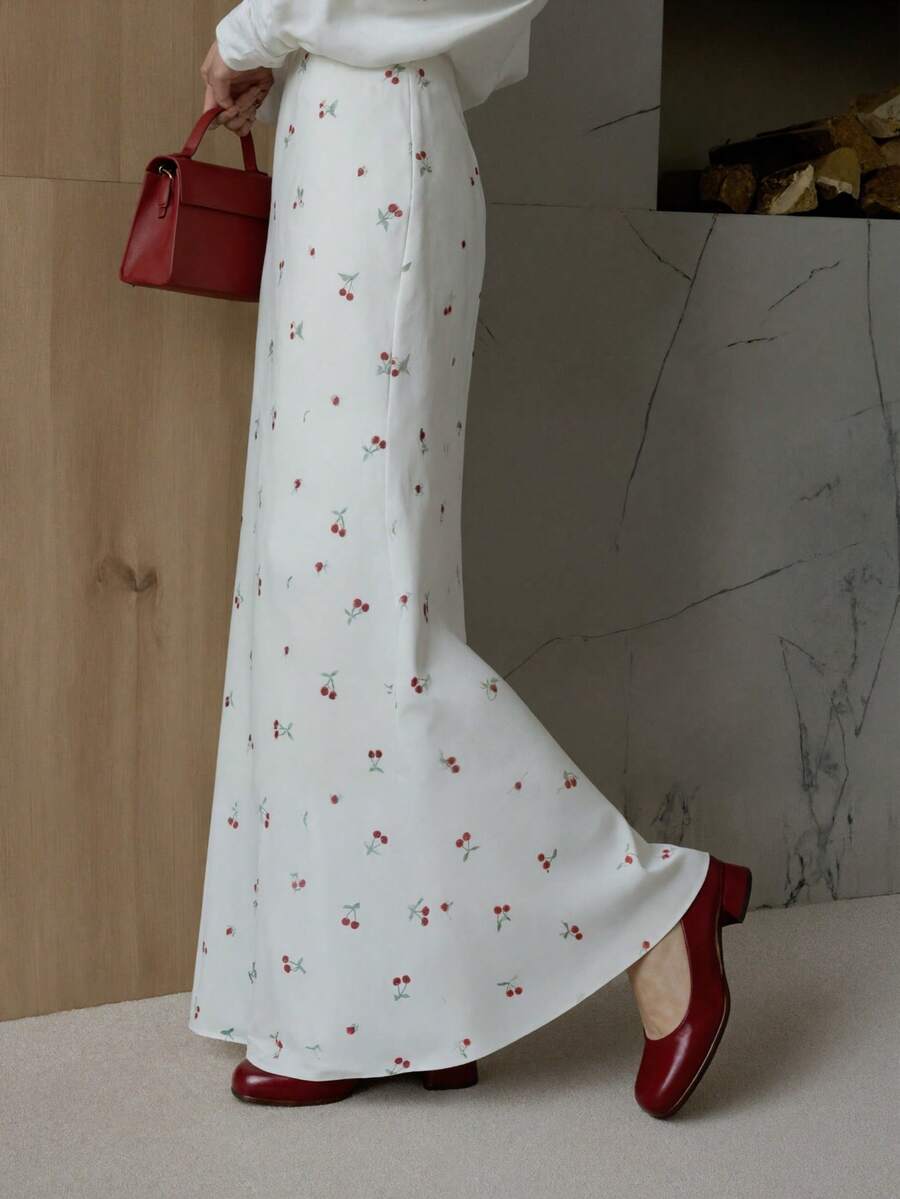 Chân váy nữ thanh lịch in họa tiết quả anh đào, kiểu dáng thời trang xuân/hè mới, họa tiết quả anh đào ngẫu nhiên phủ khắp thân váy, ôm sát cơ thể, duyên dáng, phù hợp cho phái nữ từ xuân đến hè.