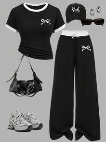 Conjunto de top de manga corta y pantalones con estampado de lazos de dibujos animados para niñas preadolescentes - Negro - Ver 1