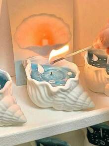 海洋风贝壳香氛蜡烛，果冻蜡烛，饰以贝壳和海星，点燃后仿佛置身海洋，适合家居装饰，可摆放在客厅、卧室、桌面、门厅等处，也可作为礼物赠送。生日、毕业、婚礼等场合皆宜。 - 彩色 - 查看 12