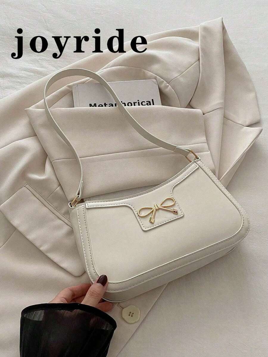 全新时尚休闲单肩包女款PU材质纯黑色、卡其色、咖啡色蝴蝶结金属配件腋下拉链化妆包