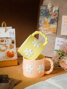 1pc 3D Embossed Ceramic Mug, French Countryside Style, Soft Pink/Yellow Body With White Daisy Pattern, Braided Handle, Rounded Rim, Suitable For Hot Beverages, Breakfast Milk Cup, Coffee Cup, Mother's Day Gift/Afternoon Tea With Friends, All Seasons