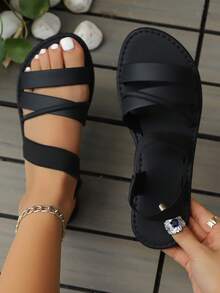 女士复古时尚舒适露趾罗马凉鞋，交叉弹力带轻便套脚沙滩凉鞋，适合日常、通勤和户外活动穿着。 - 黑色 - 查看 1