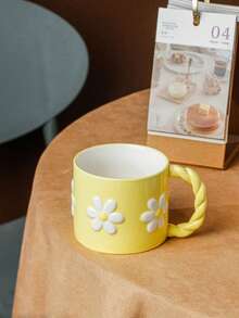 1pc 3D Embossed Ceramic Mug, French Countryside Style, Soft Pink/Yellow Body With White Daisy Pattern, Braided Handle, Rounded Rim, Suitable For Hot Beverages, Breakfast Milk Cup, Coffee Cup, Mother's Day Gift/Afternoon Tea With Friends, All Seasons