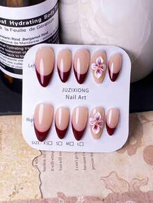10 Móng Tay Giả Hình Hạnh Nhân Thủ Công với Màu Đỏ Kiểu Pháp và Thiết Kế Hoa 3D Chạm Khắc. Đặc điểm nổi bật là họa tiết hoa 3D chạm khắc thủ công màu đỏ đậm, kết hợp với đầu móng kiểu Pháp được sơn tay màu đỏ đậm. Những bộ móng giả thanh lịch, lãng mạn và tối giản này toát lên vẻ quyến rũ, gợi cảm và sang trọng. Hoàn hảo cho việc sử dụng hàng ngày, hẹn hò, hòa nhạc và các dịp kinh doanh nhẹ nhàng, đây là món quà tuyệt vời dành cho phụ nữ và các cô gái. - Nhiều màu - Xem 2