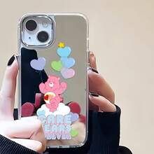 Funda para teléfono con espejo "Ositos Cariñositos Forever Balloon Paradise". Presenta con orgullo un alegre Osito Cariñosito rodeado de coloridos globos en forma de corazón y es compatible con  17,  16 Pro Max,  15 Pro Max,  13 y  12. Fabricada en TPU resistente, ofrece una excelente protección contra golpes y caídas. Un regalo encantador para familiares y amigos, perfecto para celebraciones de otoño, cumpleaños y festividades especiales. - Plateado - Ver 1