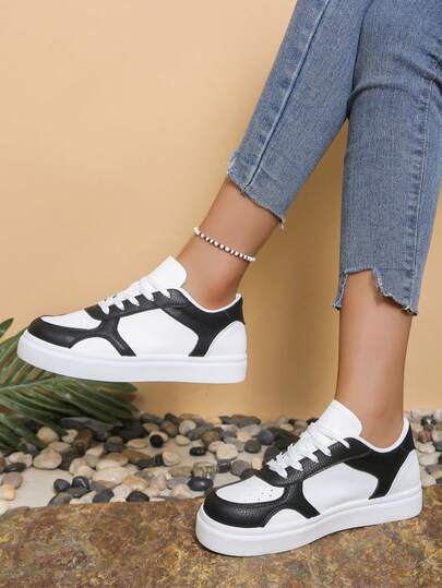 纯色系带休闲运动鞋，透气轻便，男女皆宜，适合春夏穿着。