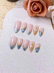 10片手工制作的杏仁形假指甲，采用蓝绿色渐变和法式星爆设计。每片假指甲都饰有手工打造的3D金色轮廓，搭配手绘蓝绿色渐变法式图案，并点缀以金色星爆。这款优雅浪漫的极简主义美甲贴片，散发着精致、性感和奢华的气息。非常适合日常佩戴、约会、音乐会和轻度商务场合，是送给女性和女孩的完美礼物。 - 彩色 - 查看 3