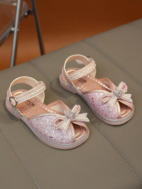 1 đôi sandal bé gái kiểu dáng ngọt ngào, đính nơ bóng, chống trơn trượt, bền, nhẹ, thoải mái, thích hợp cho tiệc tùng, thường ngày, hoạt động ngoài trời. Giày bé gái