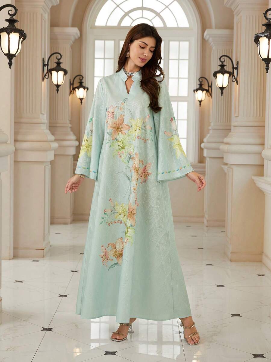 优雅女士V领长袖波西米亚印花连衣裙，采用梭织面料制成，展现充满活力的波西米亚风格