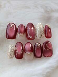10片手工制作的椭圆形红色猫眼全覆盖假指甲，饰以闪粉和蝴蝶结，时尚精致。轻松打造美甲造型，为您的指尖增添浪漫气息，展现大胆的时尚品味。完美适用于派对、晚宴和日常佩戴，是送给女性和女孩的绝佳礼物。也适合新年和情人节。美甲用品 手工按压式假指甲 - 紅色 - 查看 4