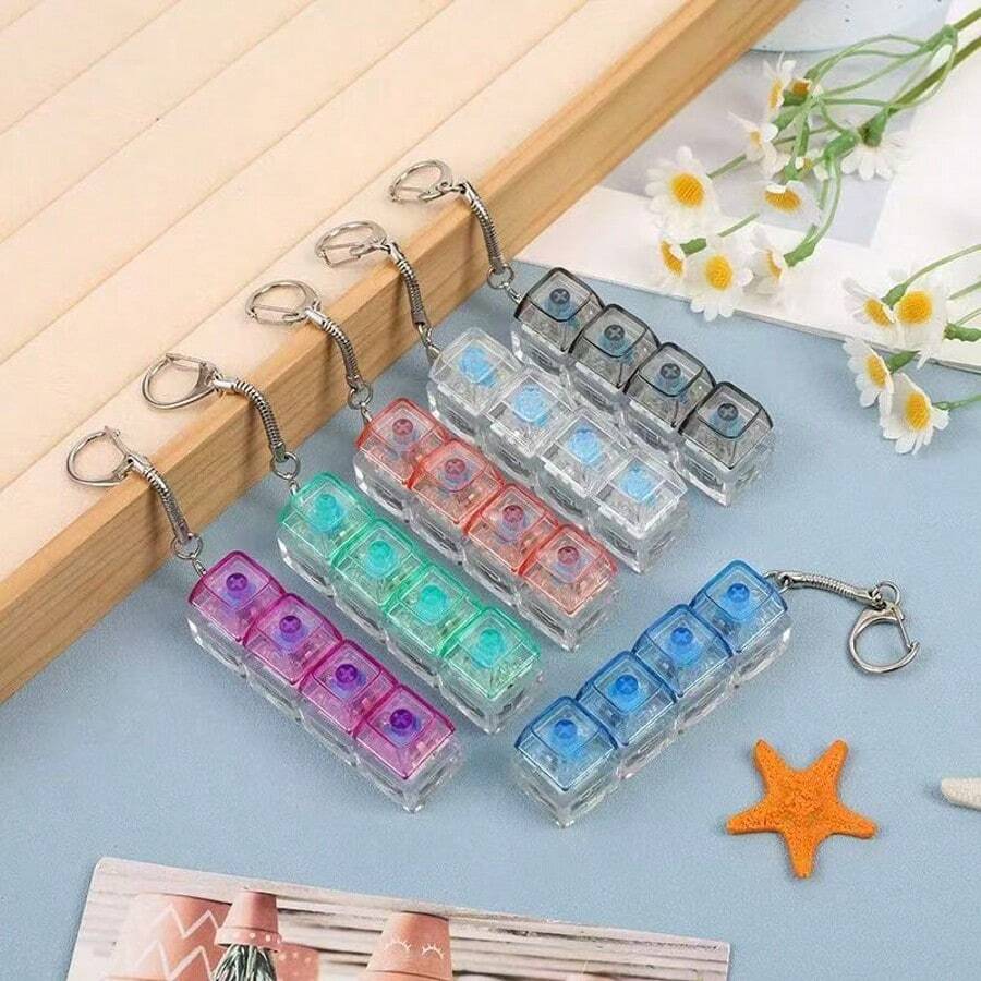 1 buah Gantungan Kunci Keyboard Pereda Stres - Mainan Ujung Jari yang Efektif Meredakan Stres, dengan Warna Hitam dan Putih yang Menarik. Tampilan, Warna, dan Desainnya Sangat Menarik, Menjadikannya Suvenir Pesta, Hadiah, dan Kado yang Sempurna untuk Teman.