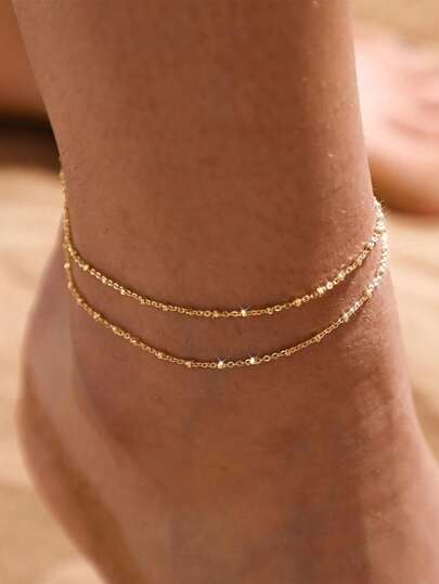 Tornozeleira minimalista e versátil em tom dourado com camada dupla, ideal para férias na praia e qualquer ocasião, também uma ótima opção de presente para mulheres.