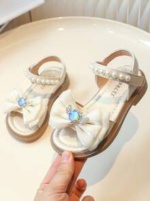 Dép xăng đan trẻ em mùa hè 2022 mới, dép xăng đan đế bằng mềm mại, thoải mái, đa năng, mũi tròn, hở ngón, đế bệt, thích hợp cho bé gái, học sinh, công chúa, dép xăng đan đế bằng thời trang cho bé gái. - Màu be - Xem 2