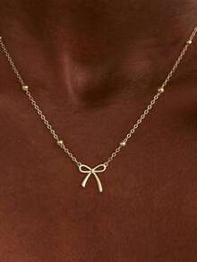 1 Elegante y encantador collar con colgante de lazo chapado en oro, un sencillo y adorable collar versátil para mujer, un collar con colgante de lazo minimalista y de moda. - Dorado - Ver 4