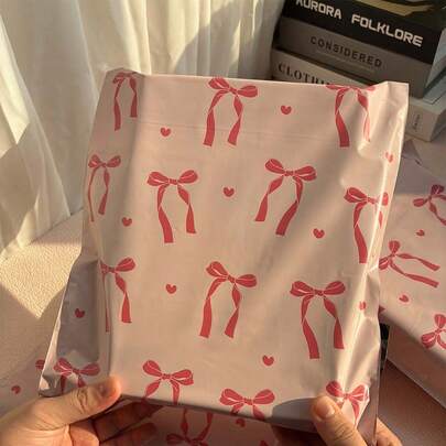 20 piezas Bolsas de envío con lazo rosa, Bolsas de plástico PE para mensajería, Bolsas logísticas de gran capacidad y grosor, Adecuadas para el Día de San Valentín, Día de la Madre, Vuelta al Colegio, Colegios, Transporte, Ropa, Papelería, Embalaje de regalos para fiestas, Uso versátil, Ideal para embalaje de regalos festivos, Cubre todas sus necesidades