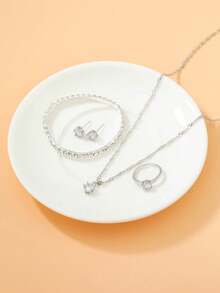 1块镶嵌水晶的圆形表盘石英表和5件套首饰，无礼盒，适合节日佩戴