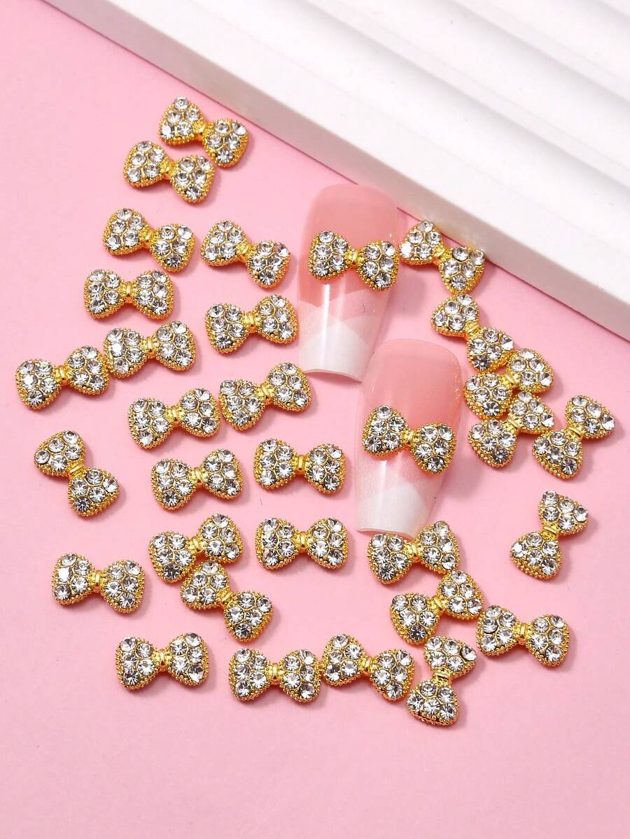 Pacote com 10 ou 20 adesivos de unhas com laço dourado falso, ideais para decoração de unhas, presentes e lembrancinhas de Ano Novo. - Multicolorido - Ver 1