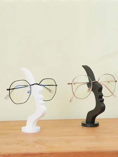 1 pieza Soporte de gafas con forma de perfil lateral, soporte curvo y único para marcos de gafas, y solución de almacenamiento artística, eleva la decoración del escritorio o la mesita de noche, diseño minimalista práctico en color negro, regalo para vacaciones/Día de San Valentín