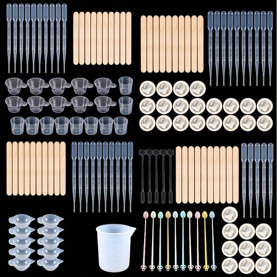 31/40件套环氧树脂浇注工具套装 - 包括30毫升塑料量杯、3毫升塑料滴管、100毫升硅胶量杯、木棒、搅拌杯、指套等。此浇注工具套装适用于颜料混合和DIY珠宝制作，是初学者的理想之选。