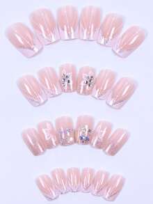 Bộ 24 móng tay giả hình quan tài kiểu Pháp, màu da tự nhiên với viền trắng, được trang trí bằng đá lấp lánh và hoa nhỏ, hoàn hảo cho các bữa tiệc, dạ hội và sử dụng hàng ngày. Bộ sản phẩm bao gồm 1 gel dán và 1 dũa móng. Có thể tháo rời và tái sử dụng. Dụng cụ làm móng nghệ thuật. - Nhiều màu - Xem 4
