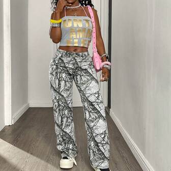 กางเกงยีนส์ผู้หญิงทรงหลวมเอวปานกลางลายต้นไม้ขาวดำ – สไตล์สตรีทอเมริกัน ปักลายโบว์ เหมาะสำหรับใส่ในงานสังสรรค์และปาร์ตี้