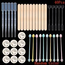 31/40件套环氧树脂浇注工具套装 - 包括30毫升塑料量杯、3毫升塑料滴管、100毫升硅胶量杯、木棒、搅拌杯、指套等。此浇注工具套装适用于颜料混合和DIY珠宝制作，是初学者的理想之选。