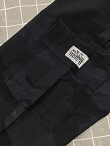 男士迷彩工装裤，带侧袋，休闲常规版型，适合户外活动，轻便透气，适合春秋季穿着。