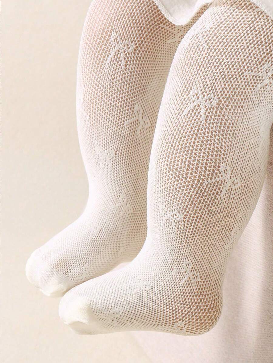 米色蝴蝶结连体衣，透气凉爽，适合女宝宝。是女宝宝生日派对的完美之选。适合0岁以上女宝宝，也是圣诞节/感恩节的理想礼物。