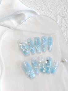 10PCS Medium-Long Coffin Press On Nails - Handmade Light Blue French Ombre Glitter Nails | Kawaii 3D Bow/Star/Rhinestone Embellished Fake Nails With Baby Blue Gradient Blending | Press-Ons Kit: 1 Sheet Jelly Glue + Mini Nail File | Reusable Shimmery False Nails For Women (Cute Aesthetic Medium-Long Coffin Shape) - Follow Your Heart - View 1