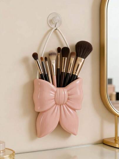 귀여운 활 모양의 정리함-욕실 메이크업 브러쉬 및 화장품에 적합합니다. 이 우아한 메이크업 브러쉬 정리함은 걸, 학생 및 창의적인 장식가에게 이상적입니다. 또한 휴가, 해변, 욕실, 침실 등에 적합합니다. 대용량. (매달린 밧줄 포함, 전원 공급되지 않음)