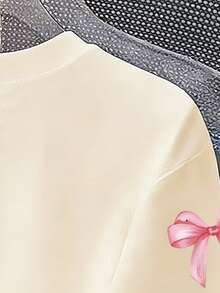 Áo thun ngắn tay cổ tròn dáng casual cho bé gái tuổi teen, có nơ và chữ, thích hợp mặc mùa hè. - Màu be - Xem 6