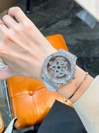 This Fashionable Transparent Back Diamond Ladies' Watch Features A Rotatable Starry Dial, Star Pattern Design, Stainless Steel Case, White Leather Strap, And Quartz Water-Resistant Movement. It Is A Great Gift For Ladies And Suitable For Daily Wear.