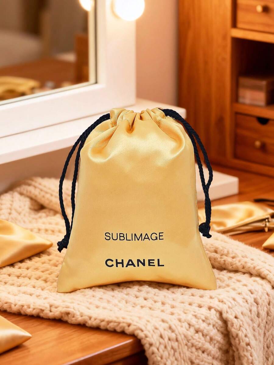 CHANEL حقيبة مكياج ذات سحاب ذهبية اللون، حقيبة مستحضرات تجميل صغيرة محمولة بتصميم بسيط - الذهبي - مشاهدة 1