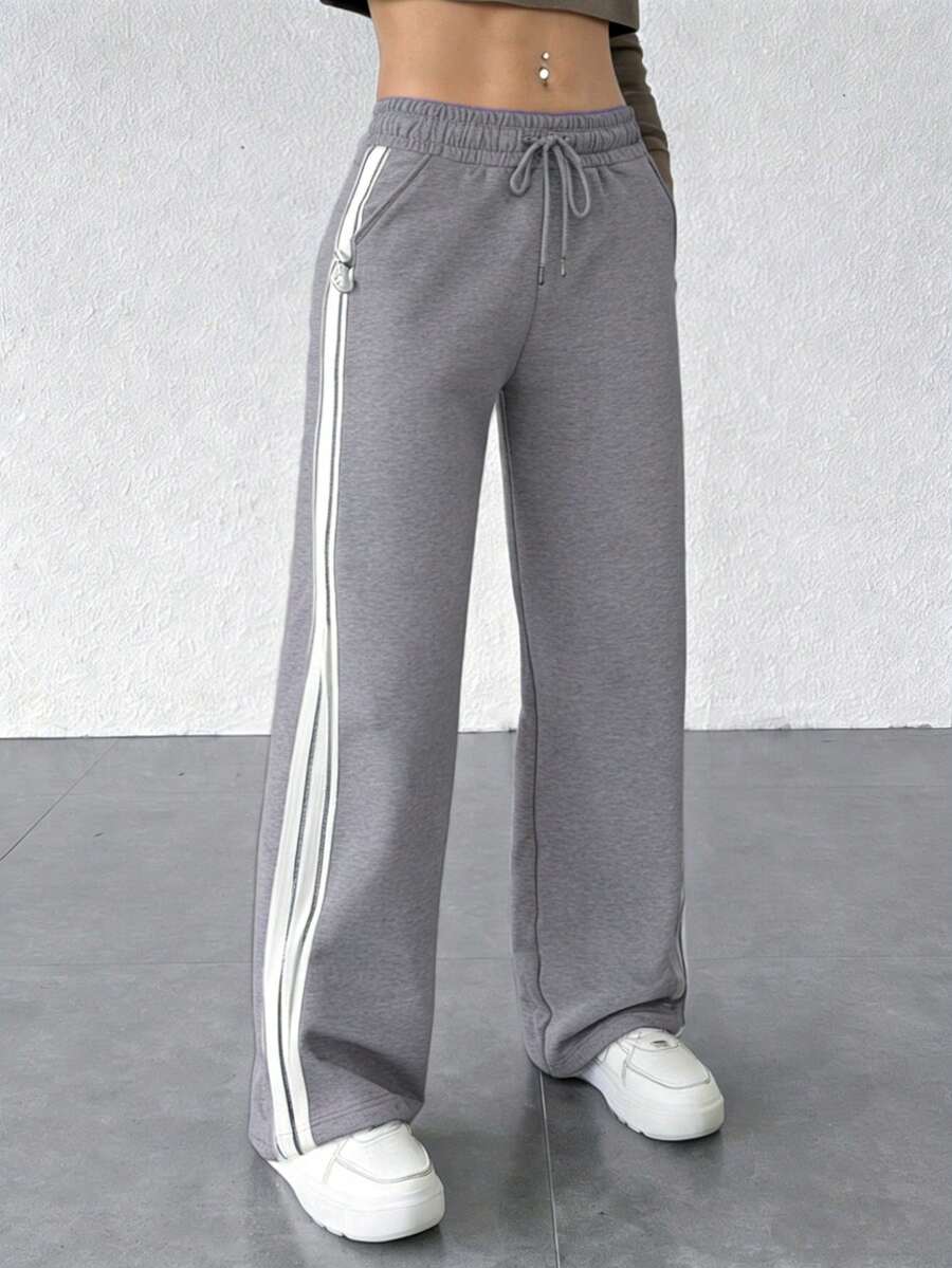 Pantalones ligeros de verano para mujer, con un diseño de corte holgado en color liso y cintura ajustable. Adecuados tanto para actividades deportivas como para el uso diario. (Nota: el primer producto utiliza un tejido más ligero y fino, tiene un precio más bajo y es de calidad estándar. Si esto le preocupa, le recomendamos que no lo compre). - gris-blanco claro - Ver 1