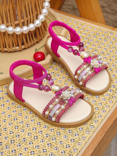 Giày sandal đế bằng hở mũi kiểu bohemian mới cho bé gái, đế mềm chống trượt, thích hợp đi biển dự tiệc.
