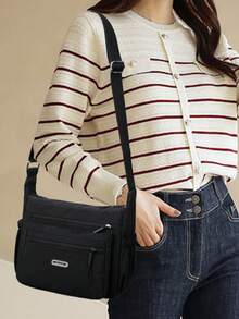 Bolso de hombro de nailon casual con correa ajustable, multicompartimento, unicolor, cierre con cremallera, forro de poliéster, bolso cruzado ligero y conveniente para uso diario - Negro - Ver 2